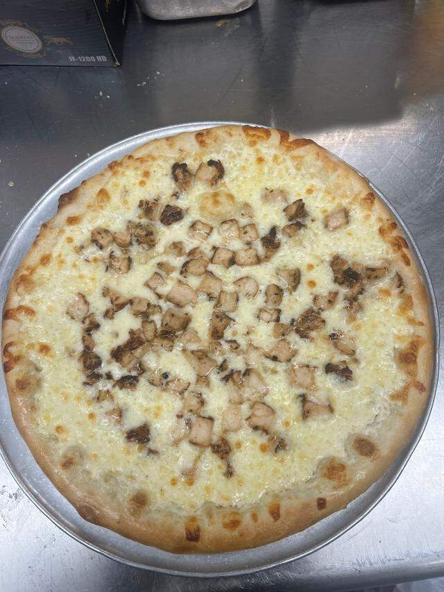 The Chicken Alfredo Pizza is a customer favorite at Zeko’s Village Italian Family Restaurant in Denver NC near Lake Norman.